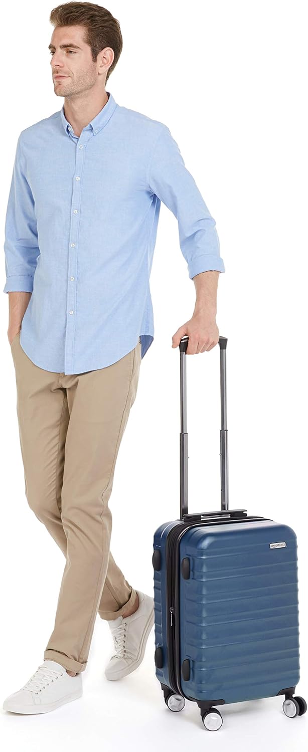 Amazon Basics 21-inch Carry On Luggage, Suitcase With Wheels (8 Spinner Wheels), TSA Lock, Expandable Capacity, Interior Divider and Pocket For Dry and Damp Clothes, Navy Blue