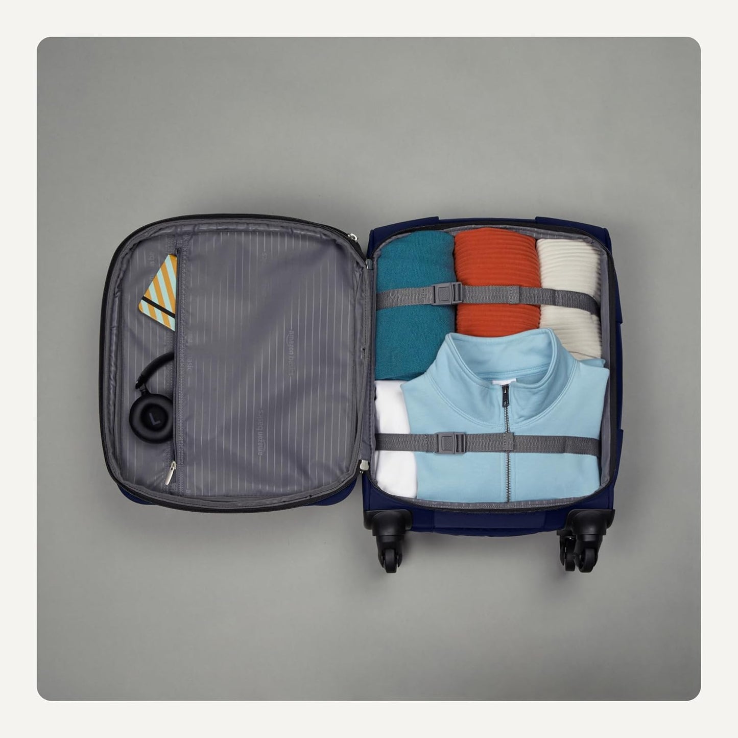 Amazon Basics Luggage, 18" Medium Carry-On Softside Suitcase With Wheels, With Four 360-Degree Multi-directional Spinner Wheels, Expandable Space, ZipperedPocket and Straps, Telescopic Handle, Black