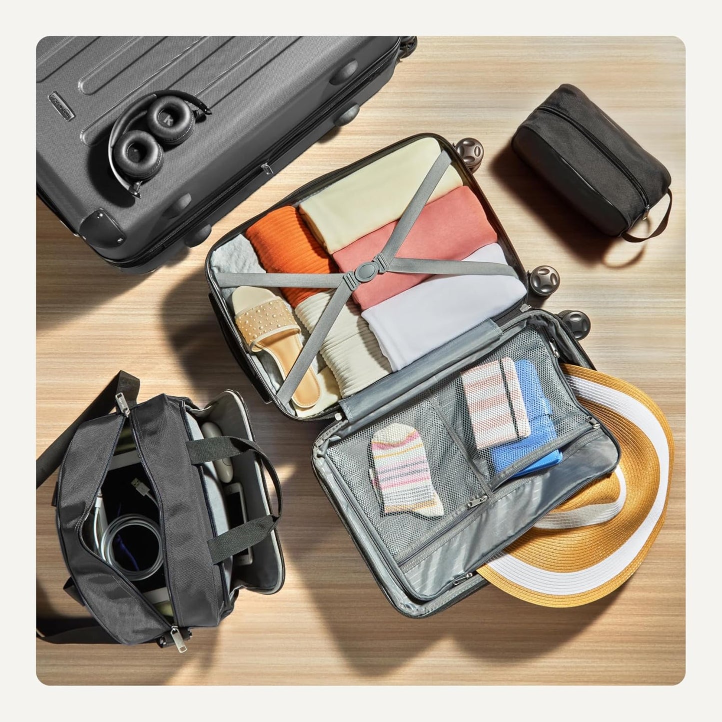 Amazon Basics 4-Piece Luggage Set, Including Two Hardside Suitcases With Multi-directional Spinner Wheels (22" Carry-On and 28" Checked), One 15-inch Tote Bag and One 10-inch Compact Travel Bag, Black